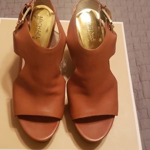 Michael Kors tan leather wedge high heels.